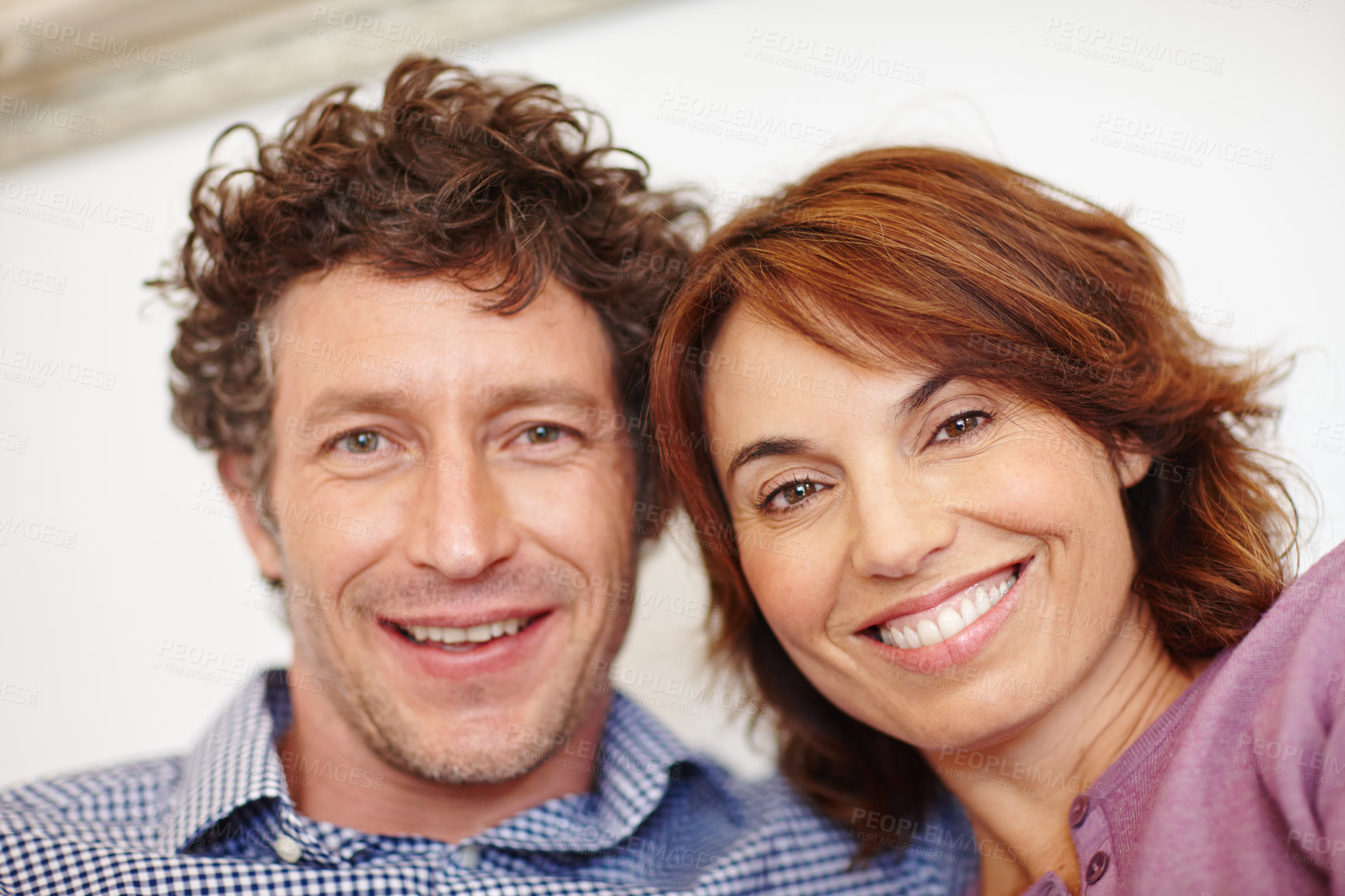 Buy stock photo Shot of a couple taking a selfie at home