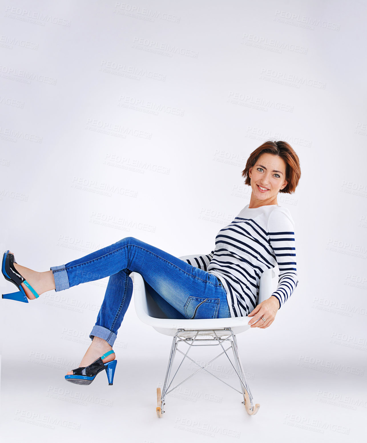 Buy stock photo Studio portrait of a young woman posing against a grey background