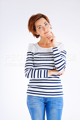 Buy stock photo Studio portrait of a young woman posing against a grey background