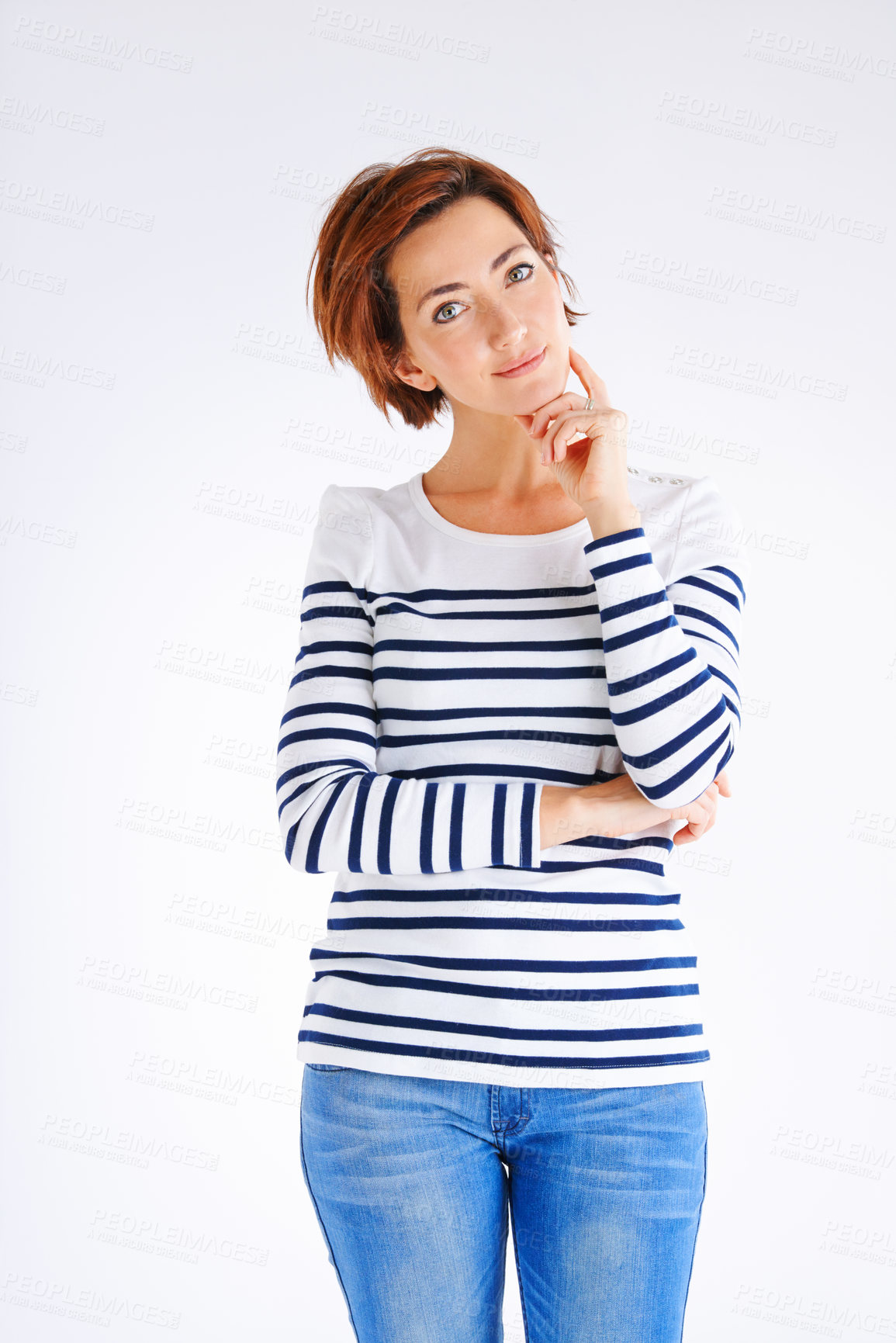 Buy stock photo Studio portrait of a young woman posing against a grey background