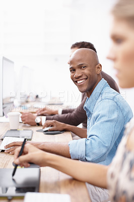Buy stock photo Portrait of three businesspeople working hard on the computers in the office