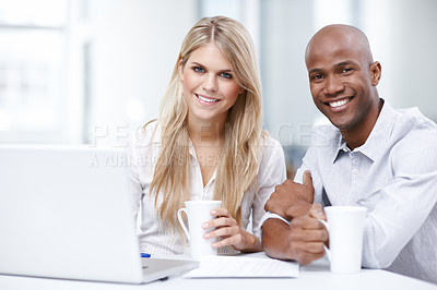 Buy stock photo Portrait of two young businesspeople working together on a project