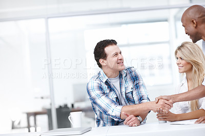 Buy stock photo A team of professionals congratulating each other