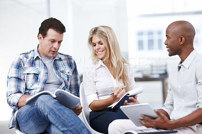 Buy stock photo A group of businesspeople in a meeting thinking of ideas and making notes
