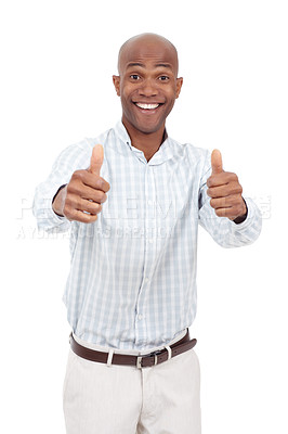 Buy stock photo Studio portrait of an excited young man giving two thumbs up to the camera