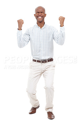 Buy stock photo Full length studio shot of an excited young man with his eyes closed raising his fists up in the air and smiling broadly at the camera