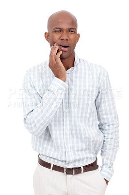 Buy stock photo Studio shot of a young african american man suffering from a toothache and holding his jaw