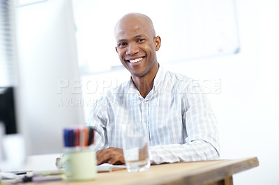 Buy stock photo Portrait of a young african american designer at work on a desktop computer in the office