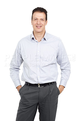 Buy stock photo Studio portrait of a man standing with his hands in his pockets and smiling at the camera