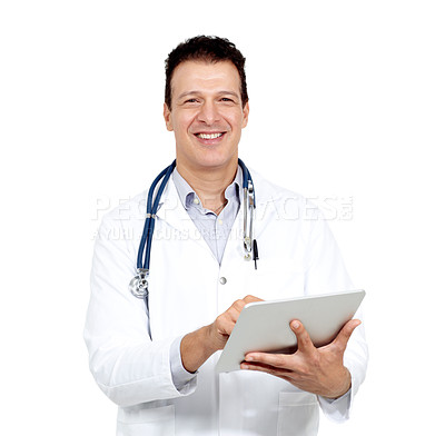 Buy stock photo Studio portrait of a smiling doctor holding a digital tablet and smiling at the camera