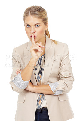 Buy stock photo Studio portrait of an attractive blonde woman with her finger on her lips gesturing to be quiet isolated on white