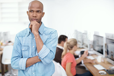 Buy stock photo A young businessman looking pensive in the office