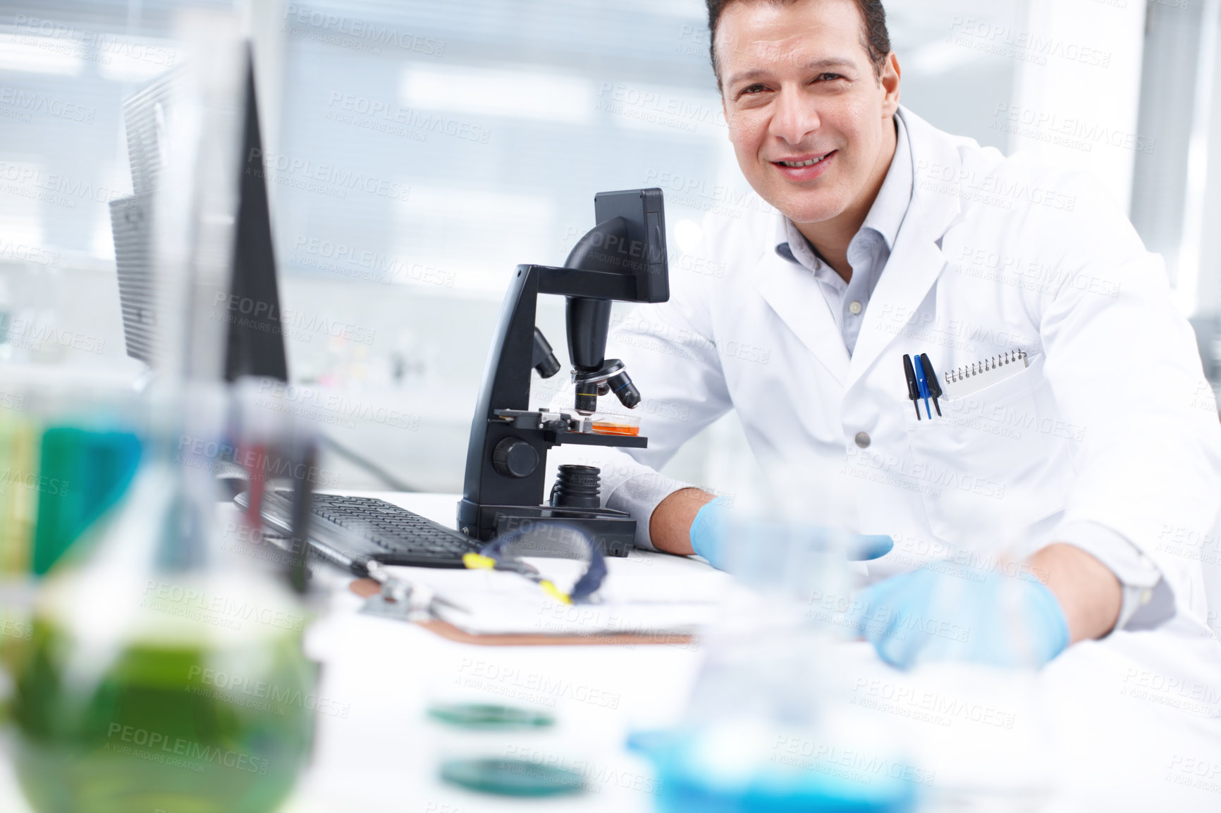 Buy stock photo Happy man, portrait and scientist with microscope for forensic science, discovery or experiment at lab. Male person, micro biologist or researcher with smile for chemical exam, test or development