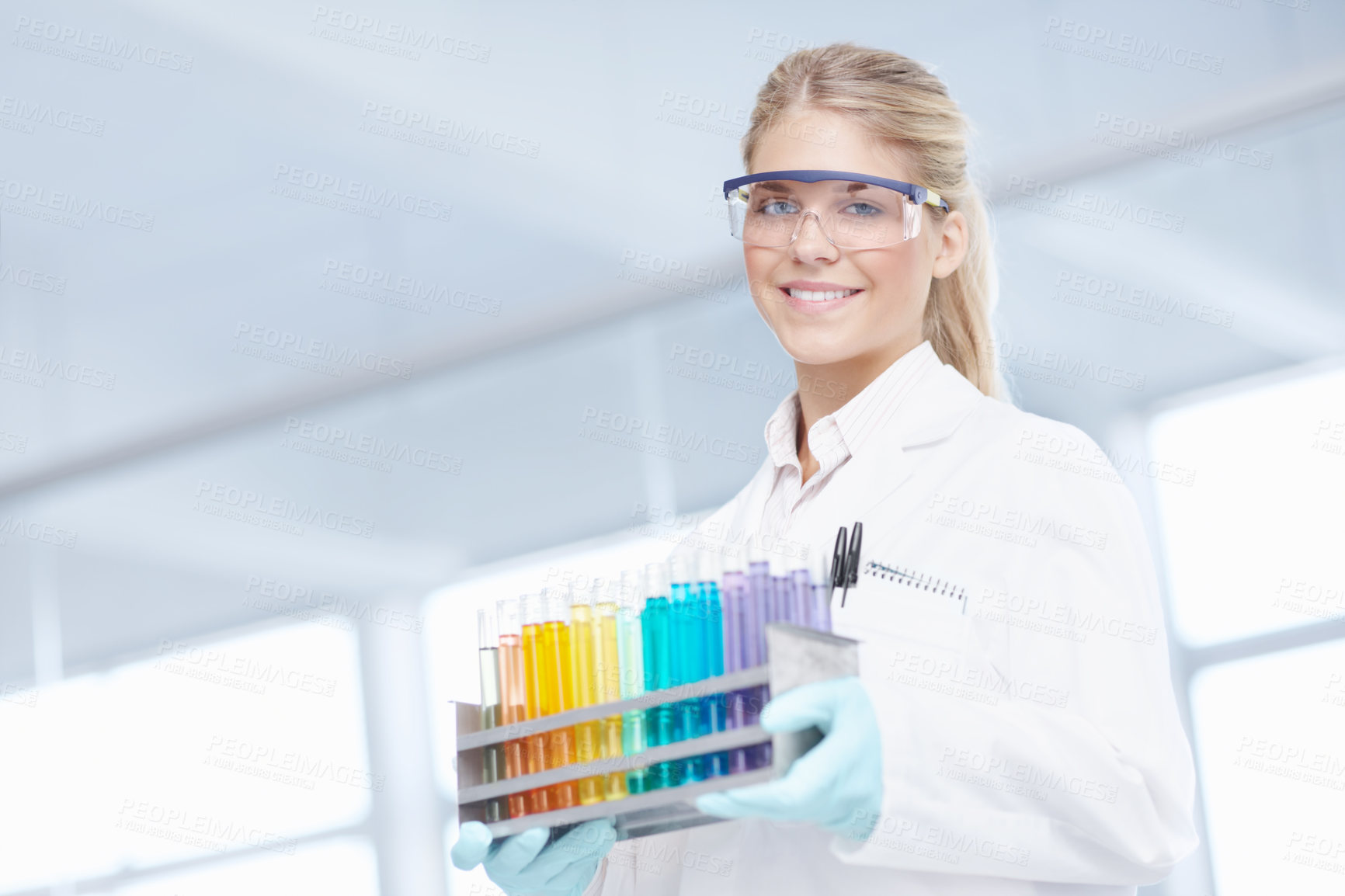 Buy stock photo Test tubes, happy woman and portrait of scientist for science breakthrough, clinical trial or discovery. Glasses, medical or vaccine research in laboratory with color or confidence for cure in Canada