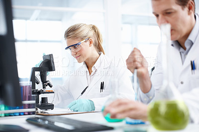 Buy stock photo Two researchers hard at work in the laboratory