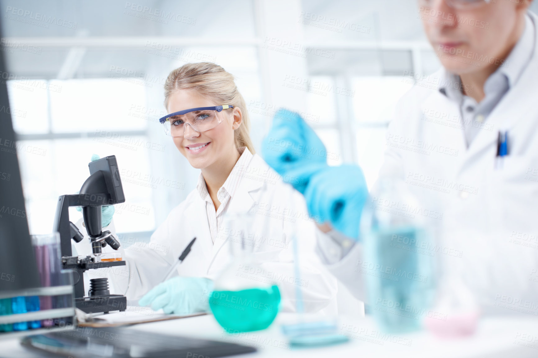 Buy stock photo Portrait, man and woman in laboratory with microscope, collaboration and technology in science study. Research, scientist and medical team in biotech, pharmaceutical innovation or vaccine development