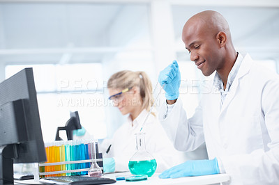 Buy stock photo A team of scientists working in the laboratory