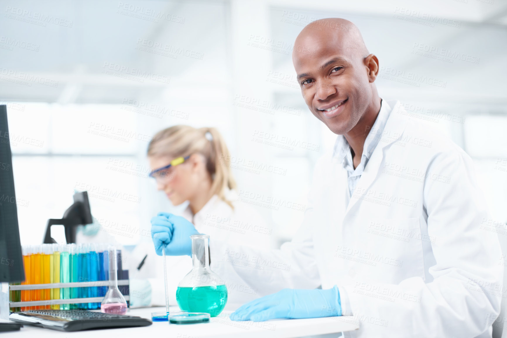 Buy stock photo Portrait, man and woman in laboratory with liquid, solution or confidence in science study. Happy, scientist or medical team with research in biotech, pharmaceutical innovation or vaccine development