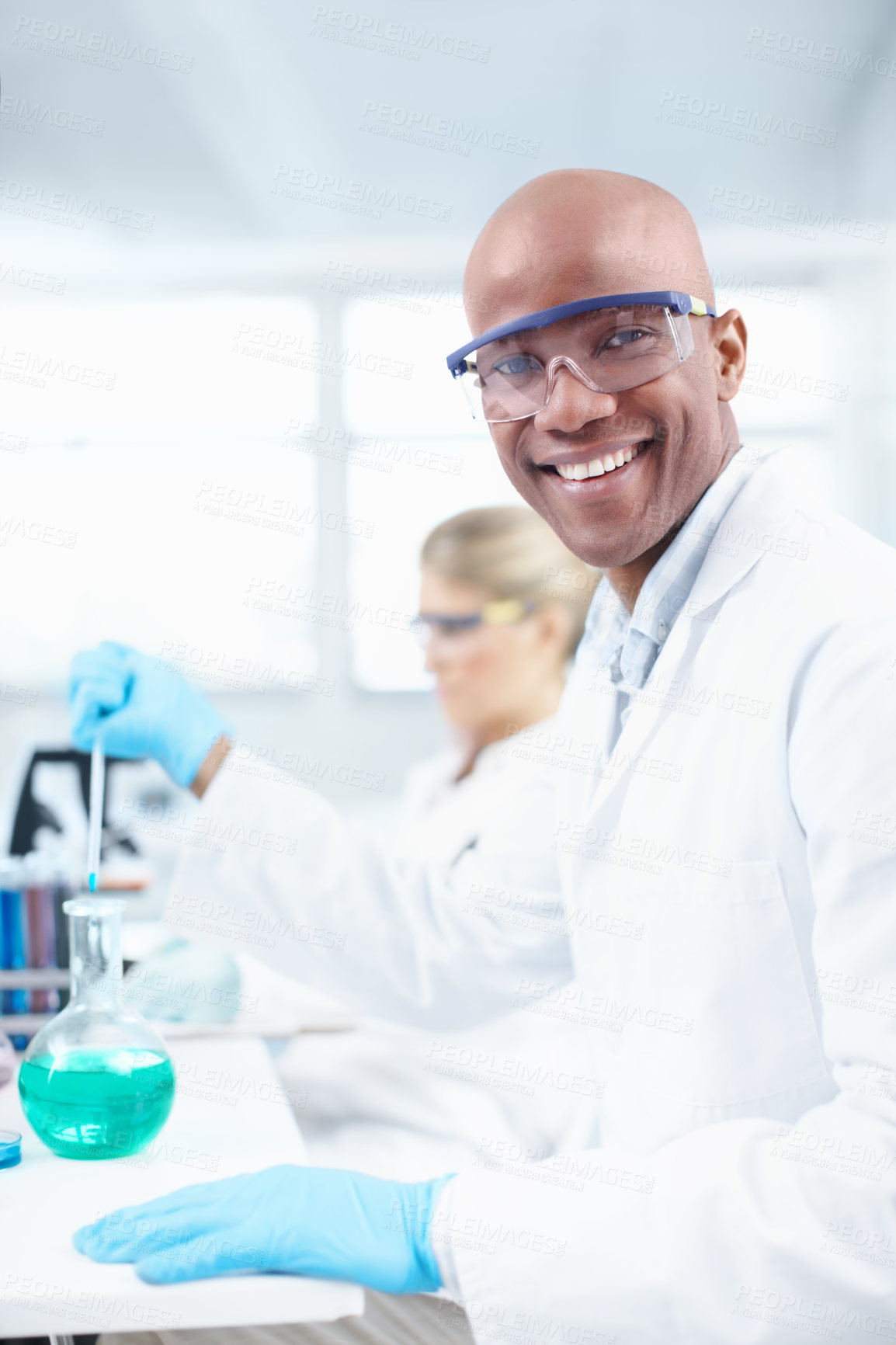 Buy stock photo Beaker, happy man and portrait of scientist in lab for science breakthrough, clinical trial or discovery. Coworking, medical or vaccine research with smile, chemical substance or glasses for cure