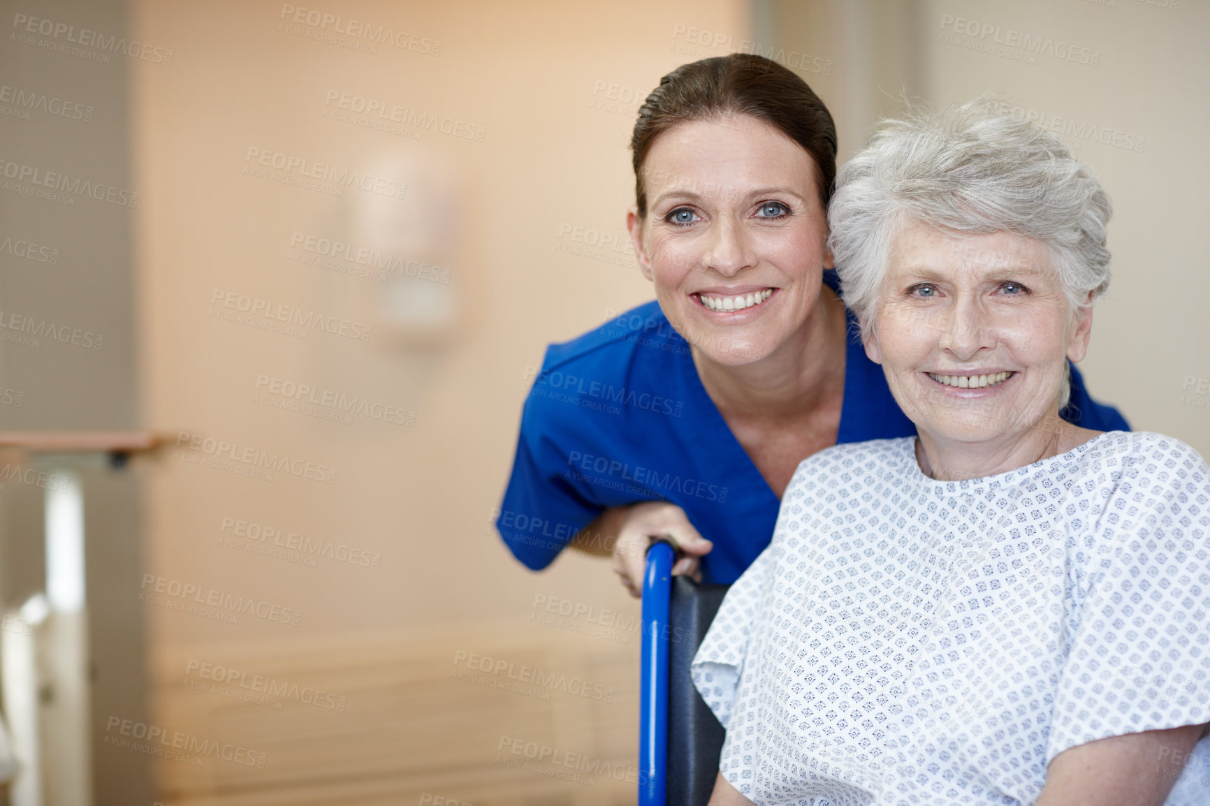 Buy stock photo Face, caregiver and senior woman in hospital, smile and healthcare for recovery, assisted living and joy. Sick, retirement and elderly person with disability, nurse and help for patient in clinic