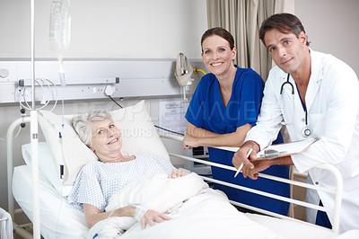 Buy stock photo Medical, team and patient portrait in hospital bed for healthcare results, surgery information or checkup. Senior woman, nurse or doctor with clipboard in clinic for health support and rehabilitation