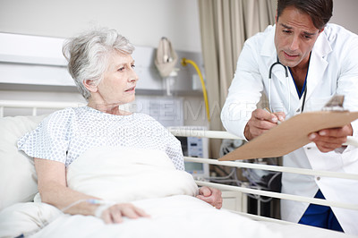 Buy stock photo Doctor, clipboard and elderly patient in hospital bed for healthcare results, surgery update and bad news. Senior woman, nurse and health support for diagnosis, illness progress and explaining notes