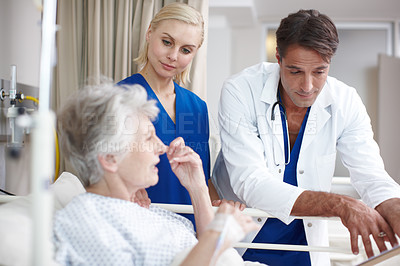 Buy stock photo Medical, doctor or old woman in hospital bed talking to elderly patient for feedback or results. Nurse, diagnosis or healthcare worker in clinic consulting senior person in retirement with assistant