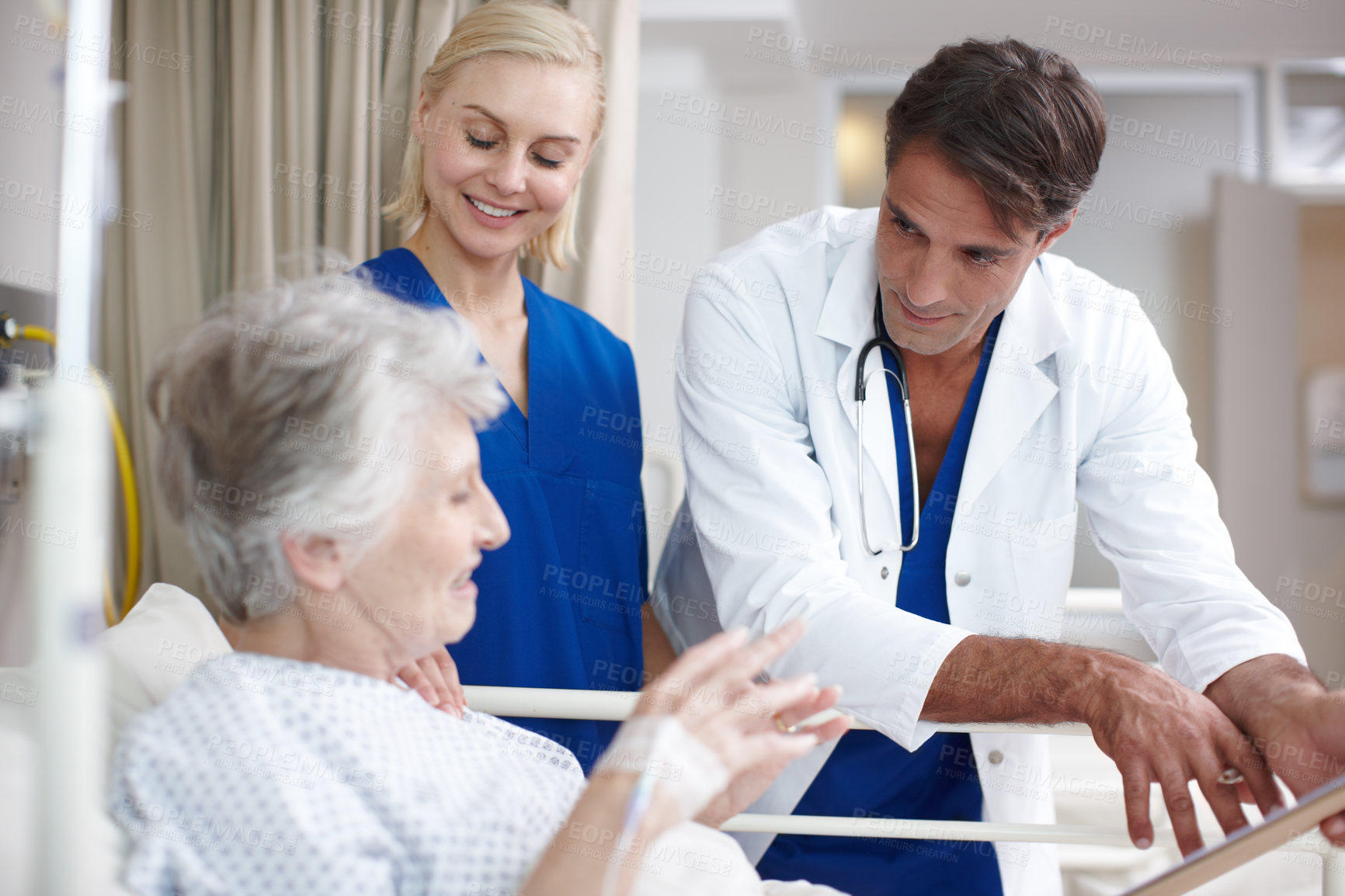 Buy stock photo Doctor, team and senior patient in hospital bed for healthcare results, surgery information or checkup notes. Elderly woman, nurse and talking with clipboard in clinic for health support or treatment