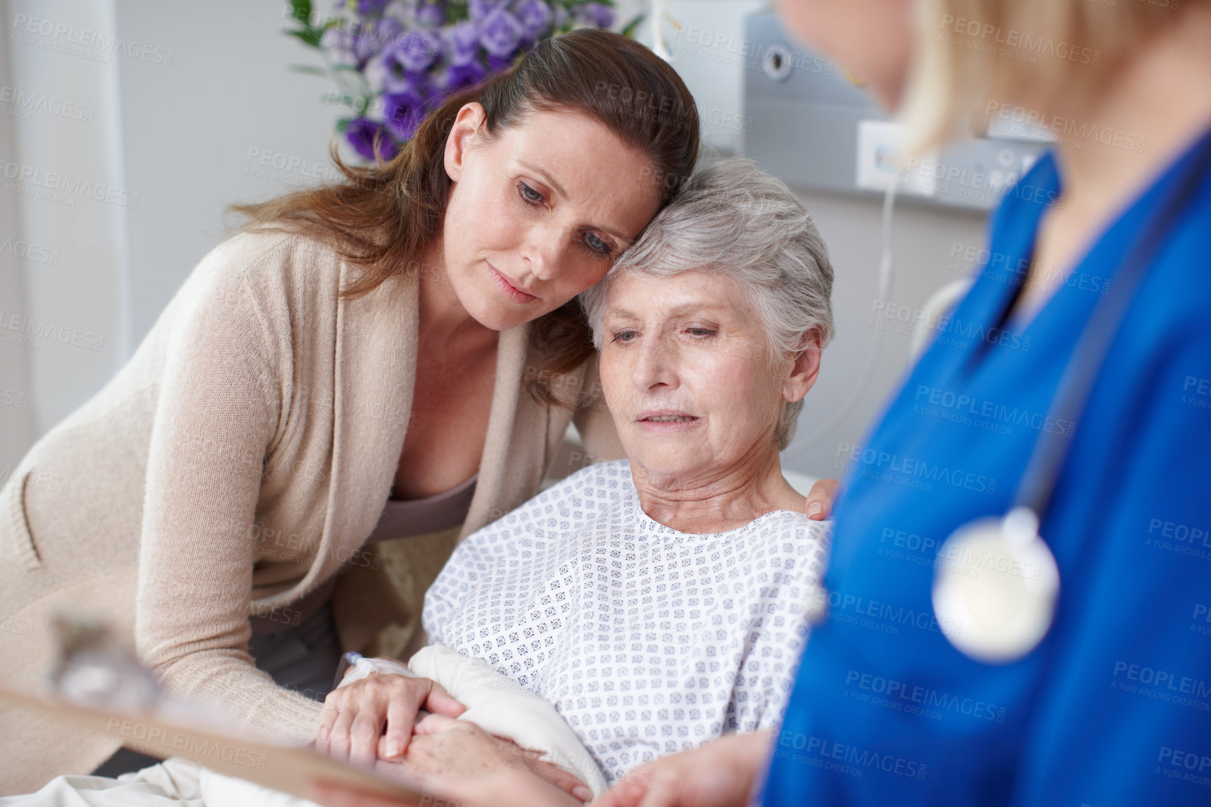 Buy stock photo Elderly mom, daughter and hug in clinic for support, love and medical health with family or women. Thinking, sad people or embrace for senior care, comfort or bad news for sick patient in hospital