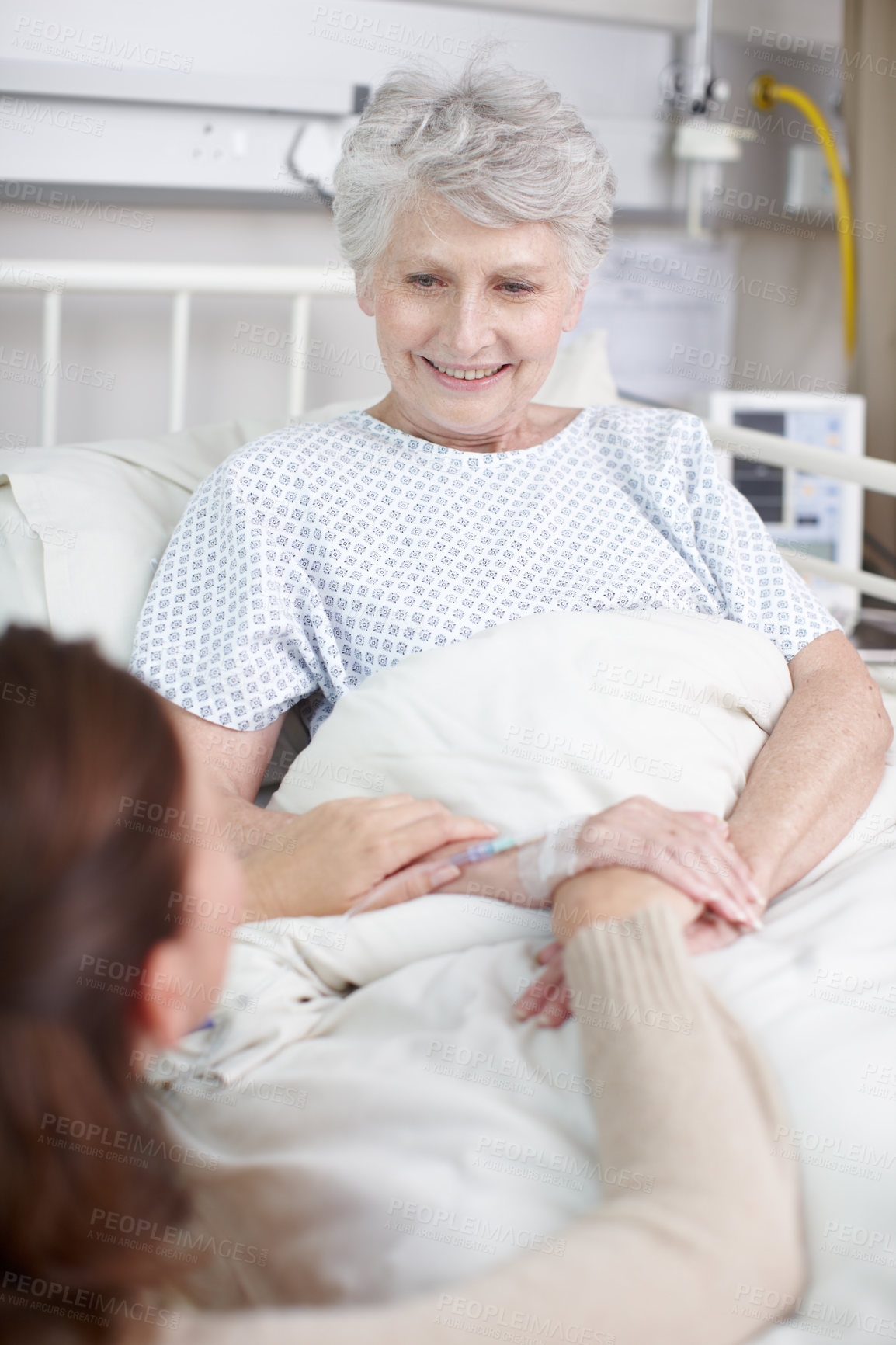 Buy stock photo Elderly mother, daughter and smile in hospital for medical exam, consultation or doctors appointment. Female people, senior care and support in clinic for visit, healthcare services or cancer patient