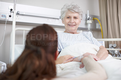 Buy stock photo An affectionate daughter consoling her sick mother in the hospital
