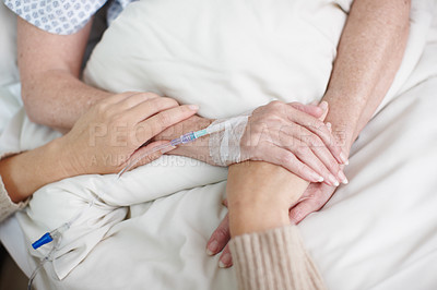 Buy stock photo Cropped image of an affectionate daughter's hand being held by her mother in the hospital