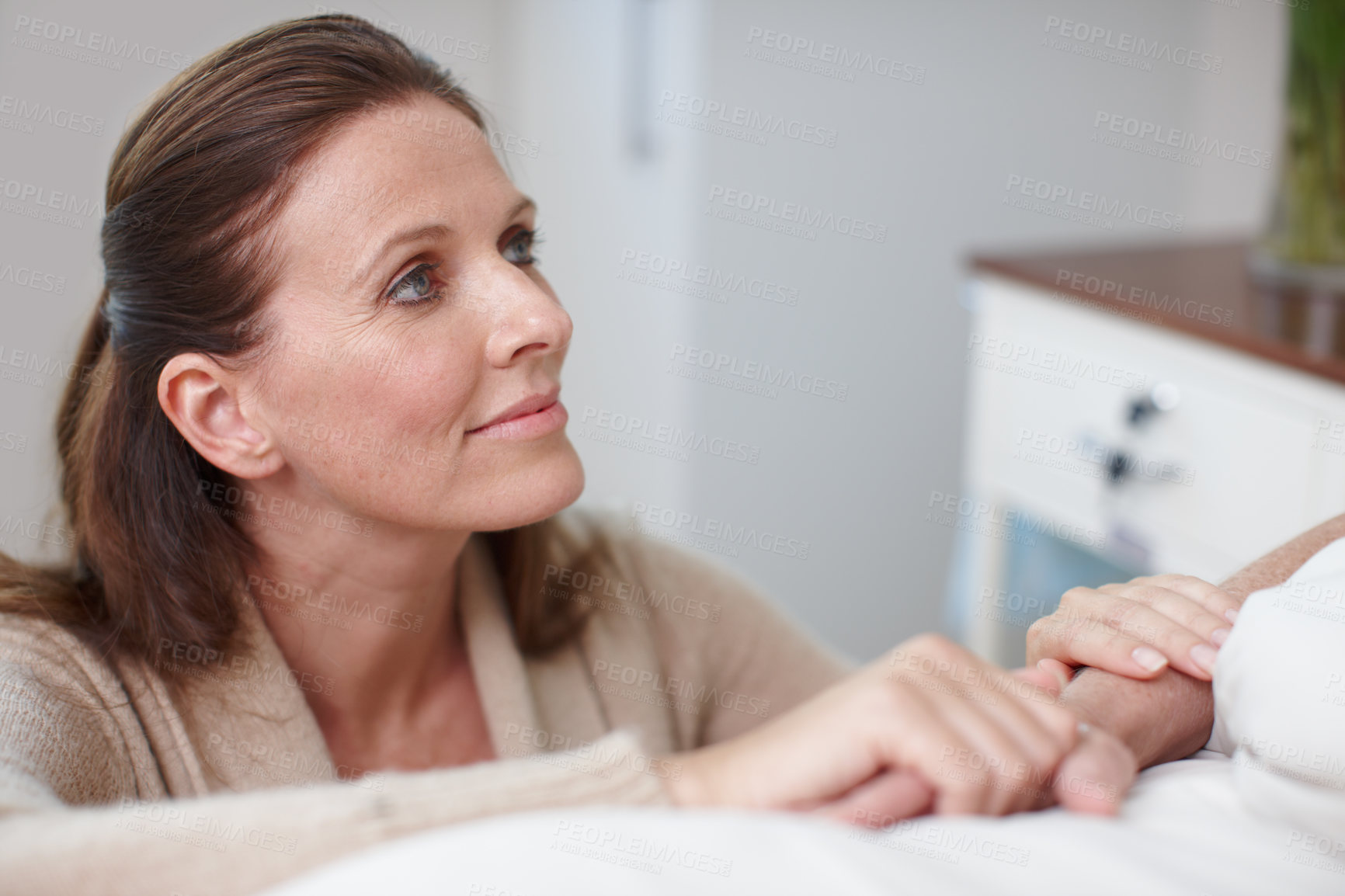 Buy stock photo Hospital, woman and holding hands with patient for support, empathy or caring for family member. Healthcare, female visitor or sick person on clinic bed for wellness, treatment or comfort for surgery