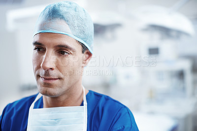 Buy stock photo Close-up of a confident male doctor thinking about the surgery