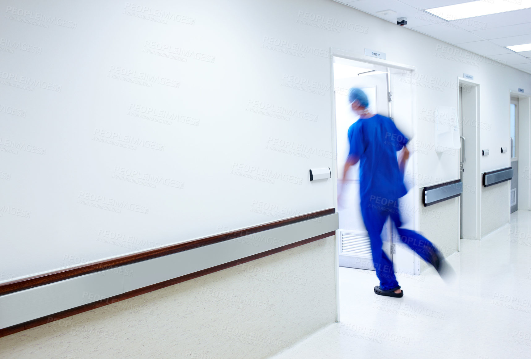 Buy stock photo A doctor running into a room in the hospital