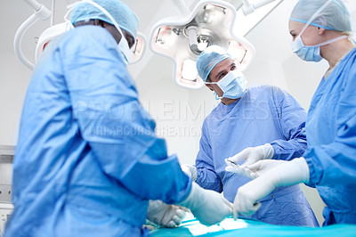 Buy stock photo Surgeon, group and theater with discussion at hospital for operation, solution or help for healthcare services. People, teamwork and low angle with tools for emergency procedure with scrubs at clinic