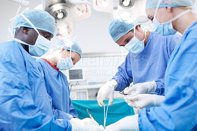 Buy stock photo Surgeon, group and theater with operation at hospital with equipment, solution or help for healthcare services. People, teamwork and circle with tools for emergency procedure with scrubs at clinic
