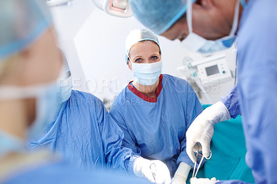 Buy stock photo Portrait of female surgeon in an operating theatre working