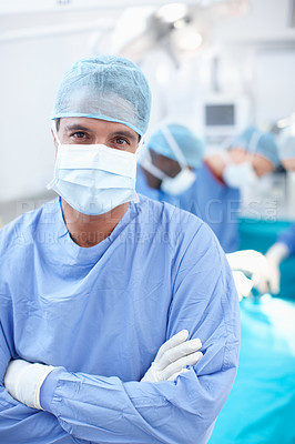 Buy stock photo Arms crossed, man and doctor in portrait with theater, medical surgery and procedure for teamwork. Hospital, team leader and surgeon with pride for operating room, healthcare and face mask for safety