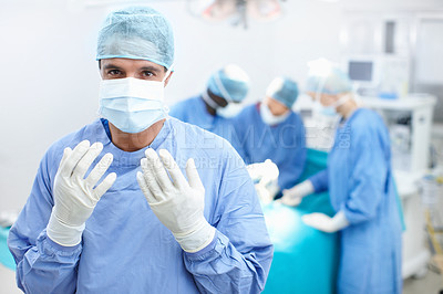 Buy stock photo Doctors, surgery and portrait with man in hospital for healthcare, operating room and emergency. Medical, organ transplant and teamwork with person in clinic for sterile, procedure and face mask