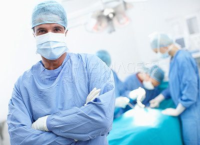 Buy stock photo Confidence, man and doctor in portrait with theater, medical surgery and procedure for teamwork. Hospital, team leader and surgeon with arms crossed for operation, healthcare and face mask for safety