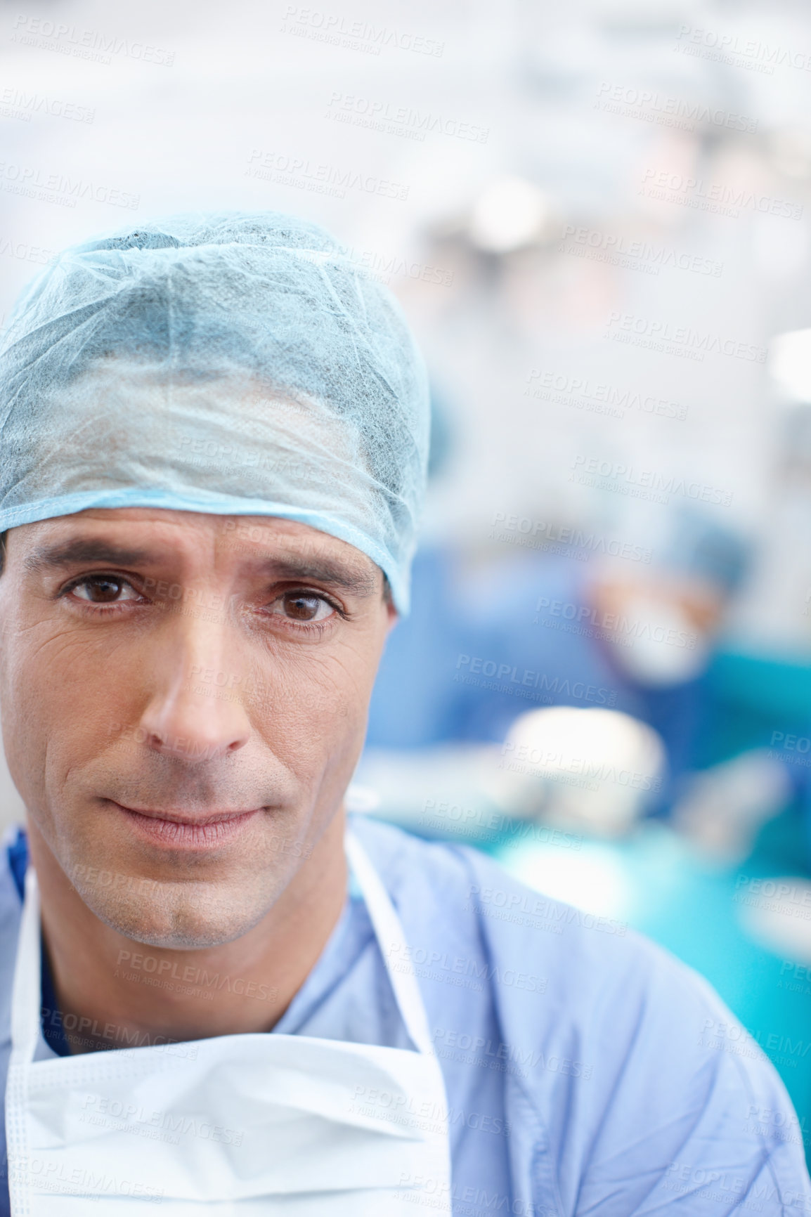 Buy stock photo Portrait of a confident mature doctor wearing his hospital scrubs