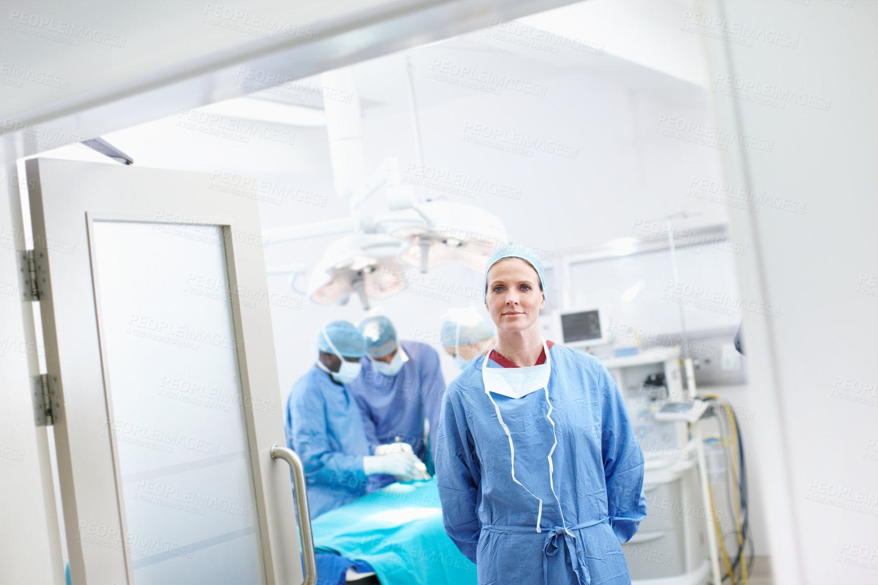 Buy stock photo Woman, surgeon and team in hospital for healthcare, operation and confident in service. Doctor, medical professionals and portrait in theater for procedure, medicare and PPE for infection prevention