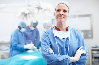 Buy stock photo Hospital, woman and doctor in portrait for theater, medical surgery and procedure for staff. Arms crossed, team leader and surgeon with smile for operating room, healthcare and ppe uniform for safety