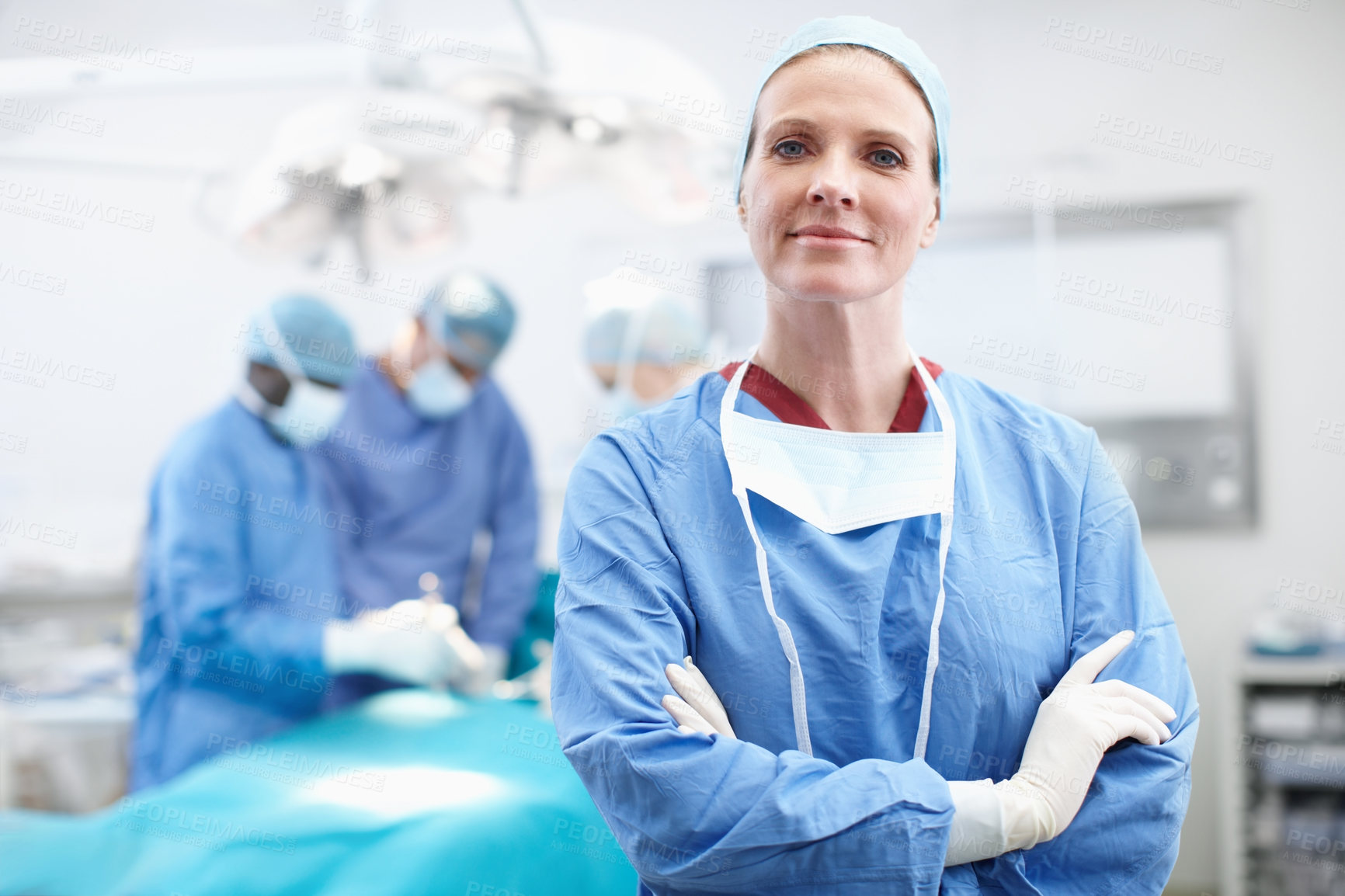 Buy stock photo Hospital, woman and doctor in portrait for theater, medical surgery and procedure for staff. Arms crossed, team leader and surgeon with smile for operating room, healthcare and ppe uniform for safety