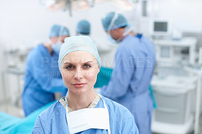 Buy stock photo Woman, surgeon and team in theater for healthcare, operation and confident in service. Doctor, medical professionals and portrait in hospital for procedure, medicare and PPE for infection prevention