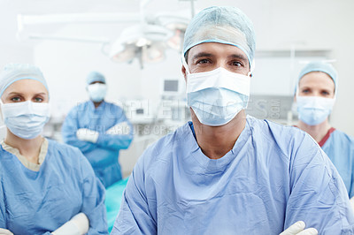 Buy stock photo Portrait of a medical team of surgeons standing together in an operating theatre before surgery