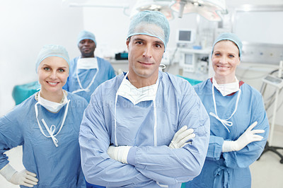 Buy stock photo Theater, doctors and teamwork with smile in portrait, medical surgery and procedure with confidence. Hospital, surgeons and man leader with arms crossed for operating room, clinic and ppe for safety
