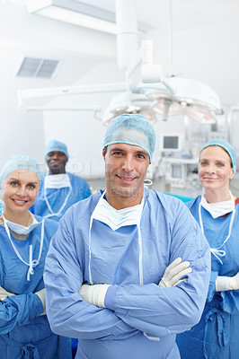 Buy stock photo Doctors, teamwork and happy in portrait for theater, medical surgery and procedure with confidence. Hospital, surgeons and man leader with arms crossed for operating room, clinic and ppe for safety