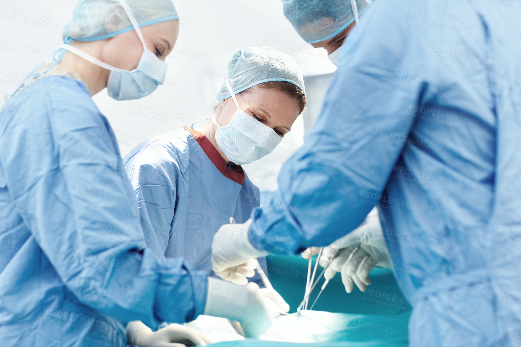 Buy stock photo People, cutting or surgeons in theatre for surgery, emergency accident or healthcare in hospital clinic. Medical, mask or doctors in surgical scrubs in operating room for teamwork, operation or help